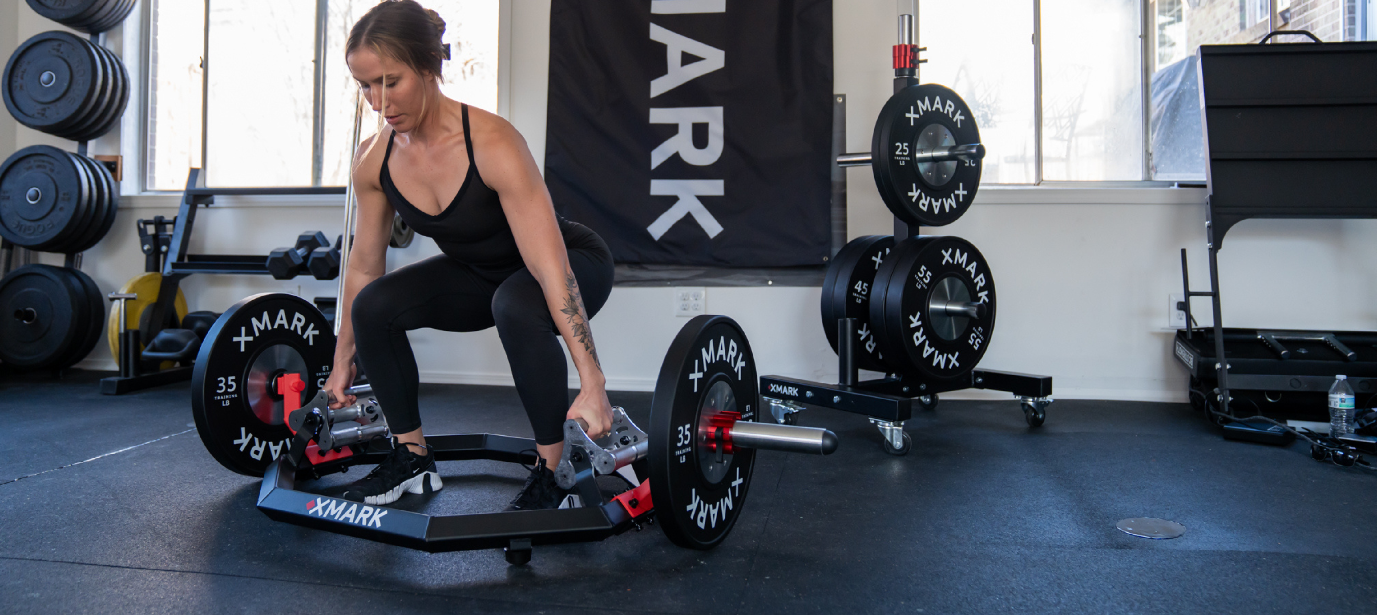 Female doing deadlift with Trap Barbell
