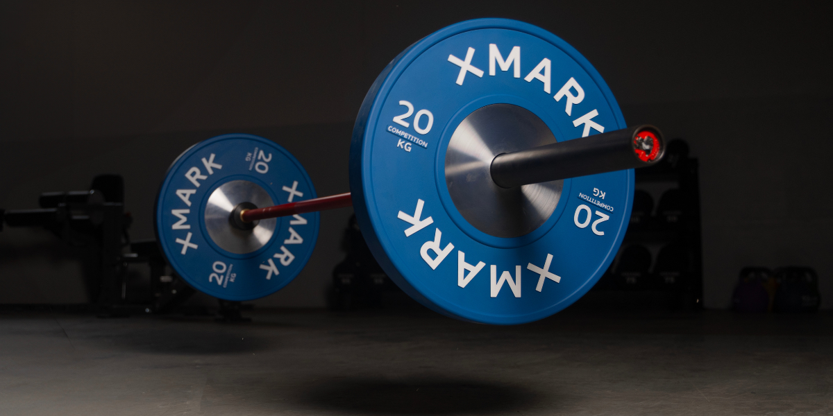 XMARK Blue 45lb Bumper Plates Being dropped on the ground