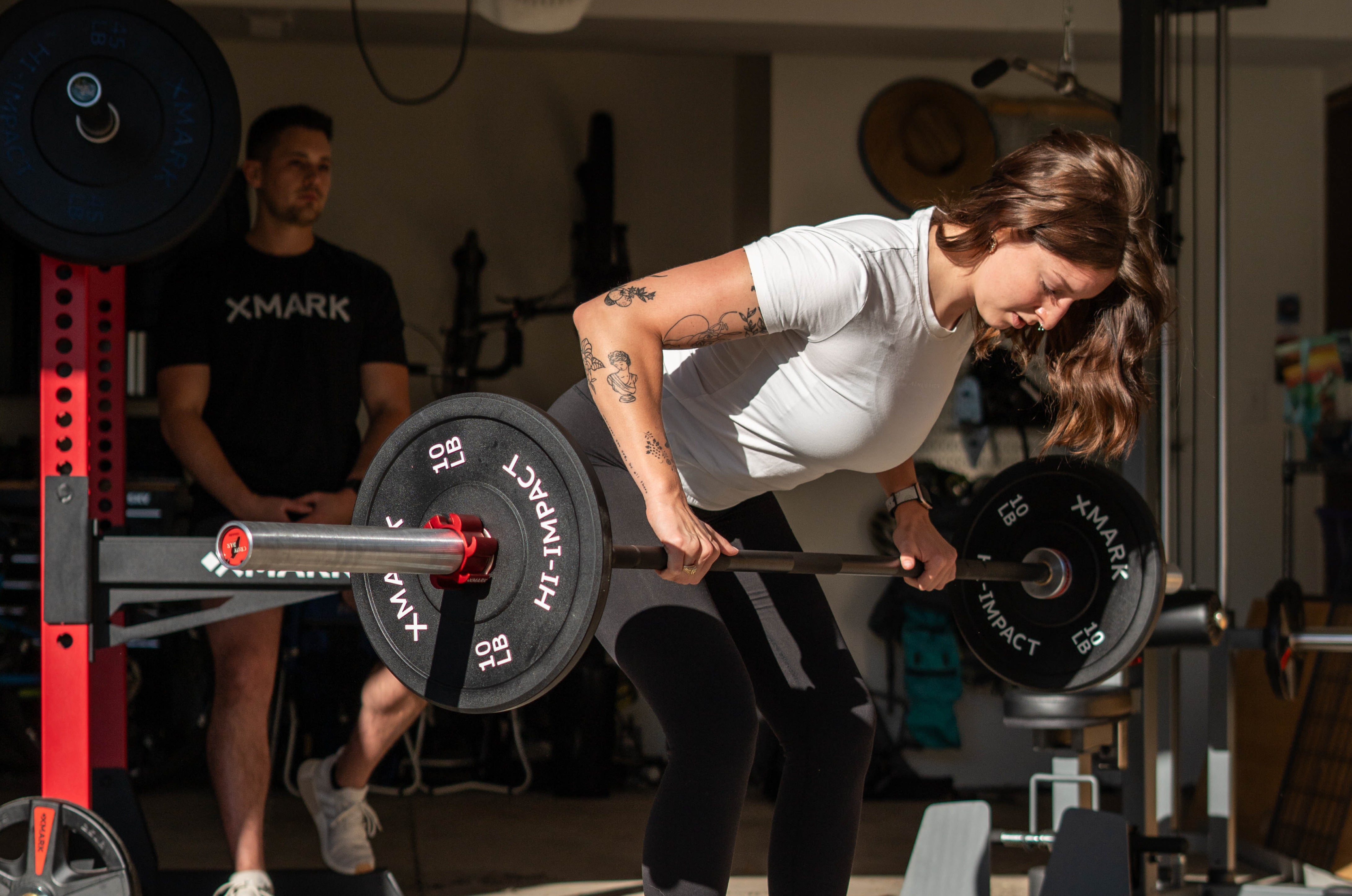 Female Performing Bent over Barbell Rows