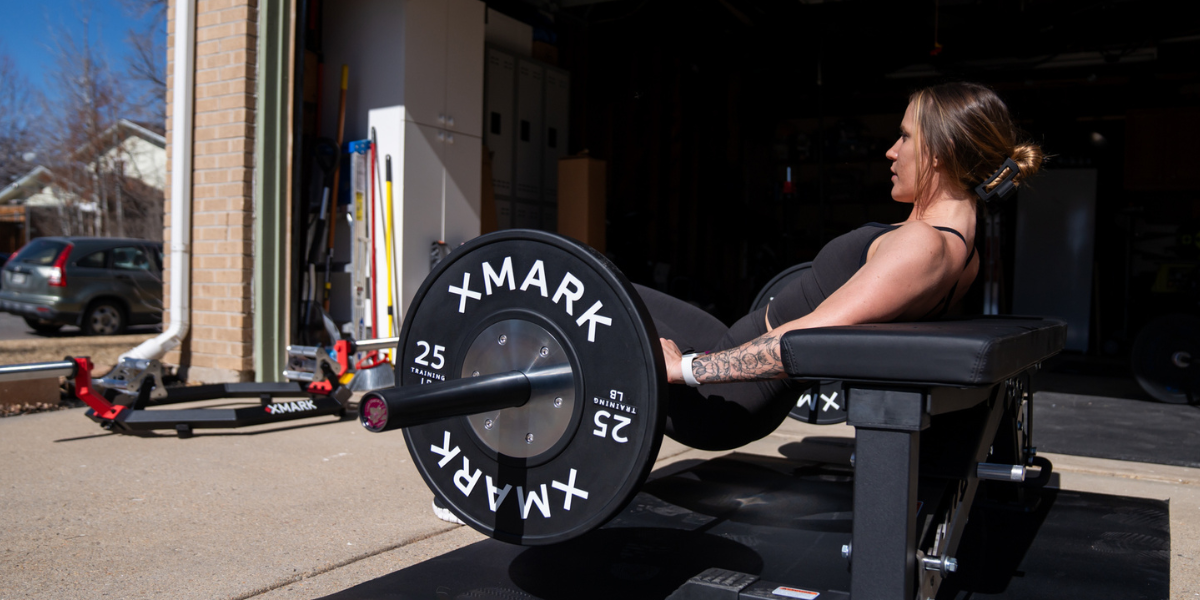 Woman using bench for hip thrusts