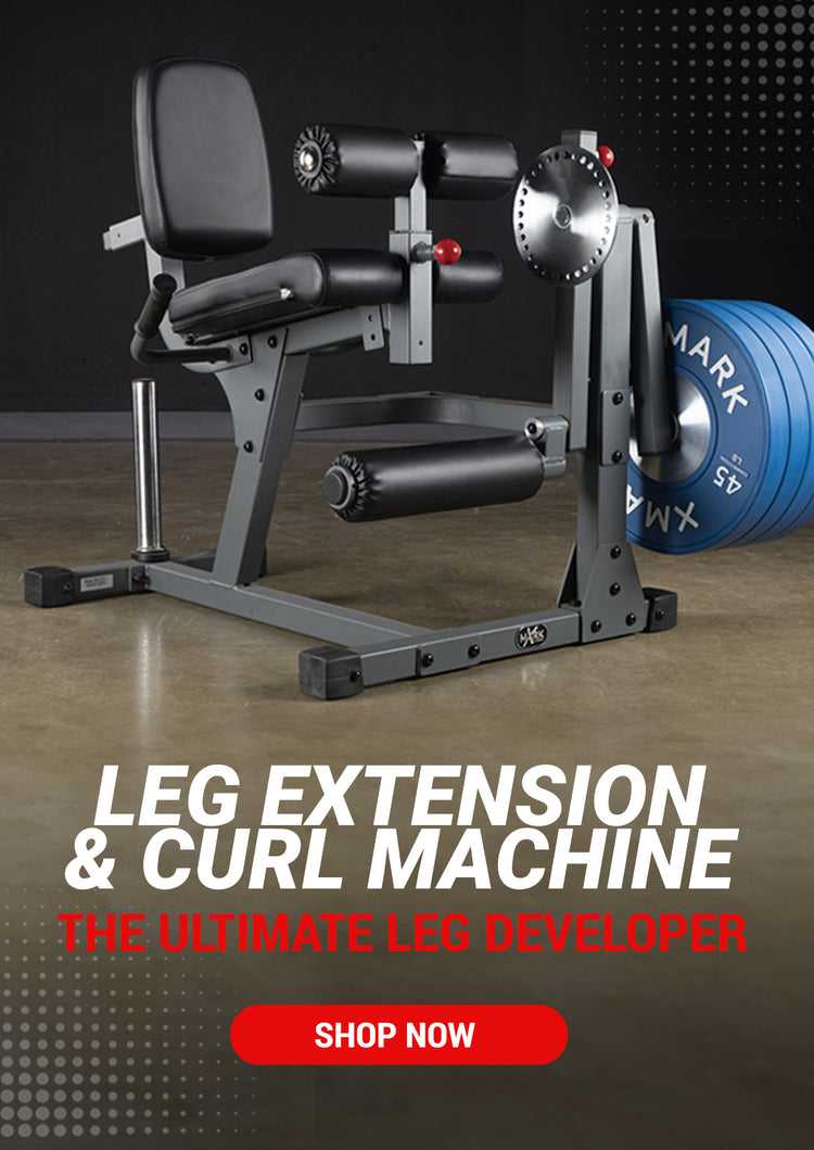 XMARK leg extension and curl machine with 45 pound weight plates. 