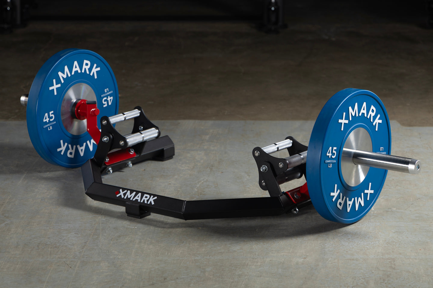 XMARK Open Hex Bar loaded with 45 lb bumper plates side view