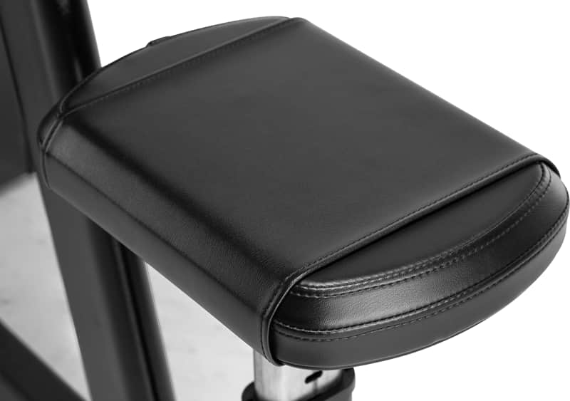 Close-up of a black padded seat cushion with stitched edges and a curved lower lip.