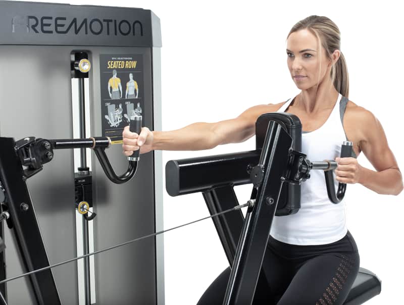 A woman exercising on a A Freemotion seated row machine