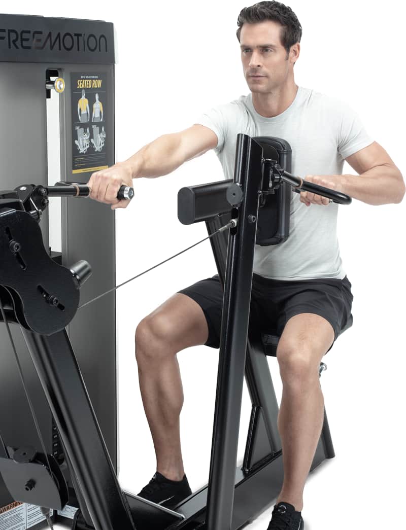 Man exercising on a A Freemotion seated row machine