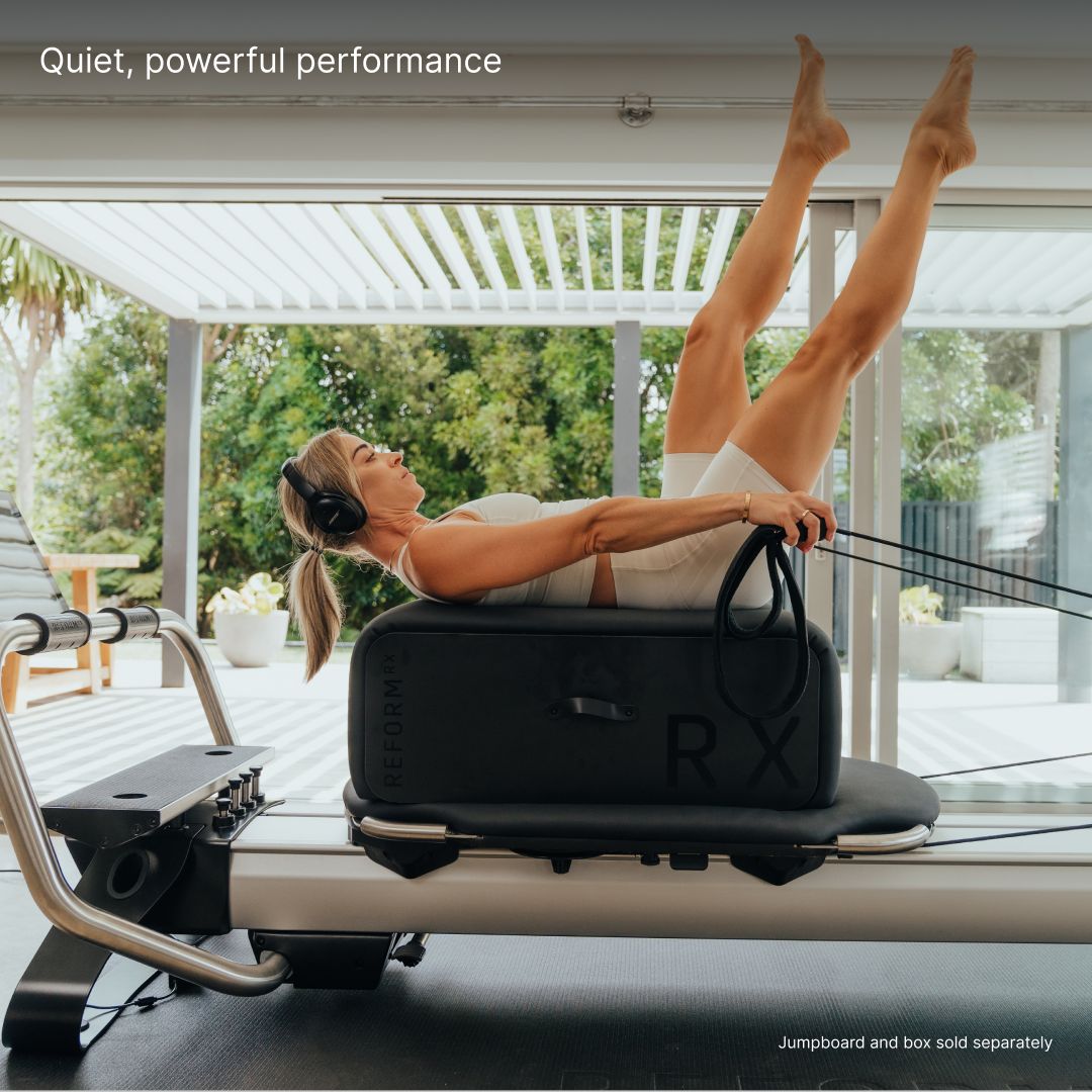 Woman using a Pilates reform
